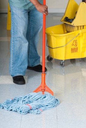 Crimson Services LLC janitor in Grottoes, VA mopping floor.